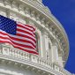 Washington DC Capitol dome detail with waving American flag, USA